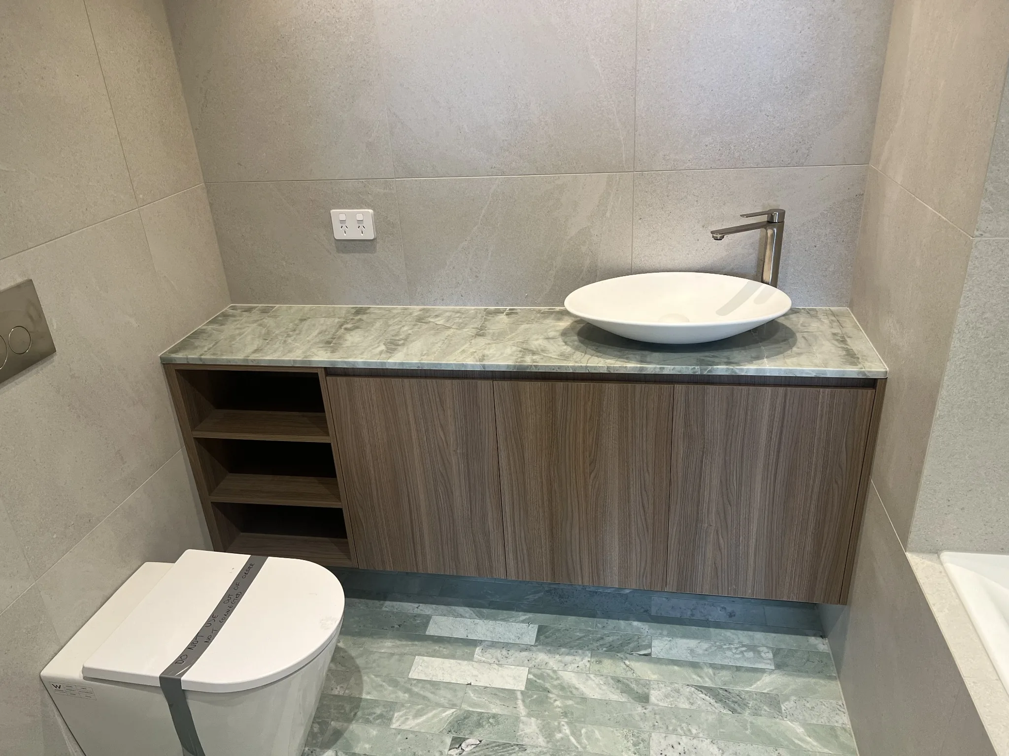 Bathroom vanity in timber with green stone top