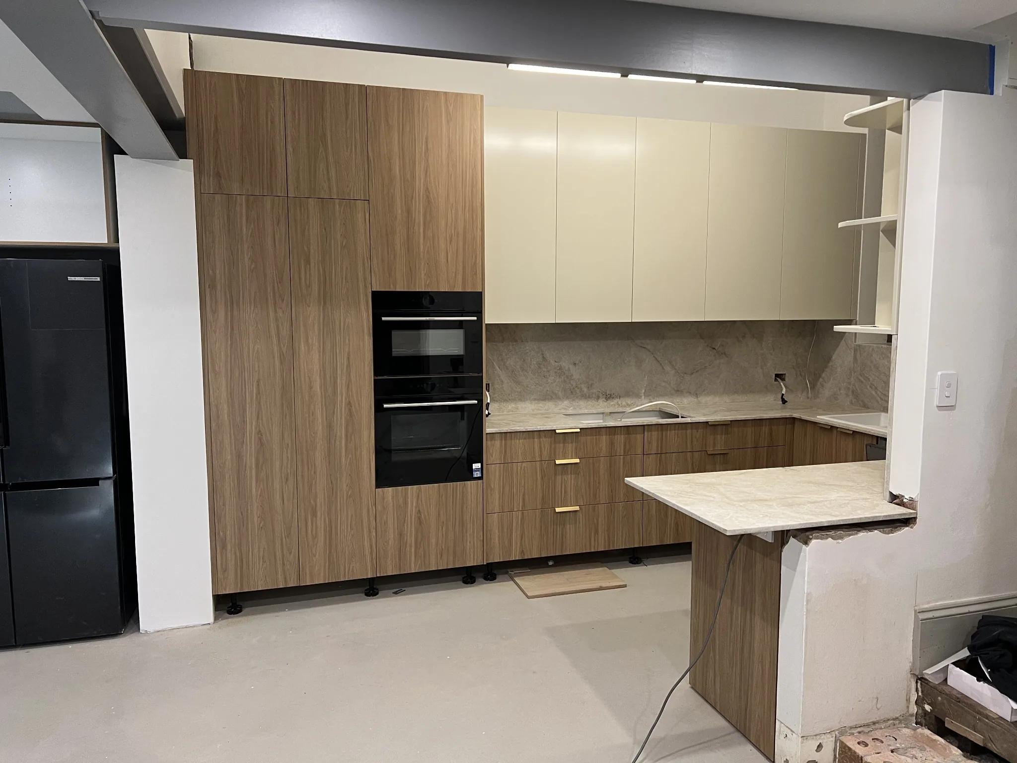 Walnut kitchen joinery during installation