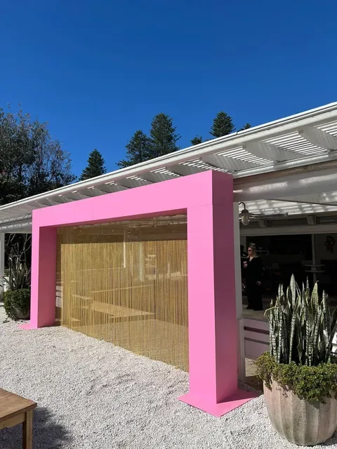 Pink architectural feature viewed from side angle